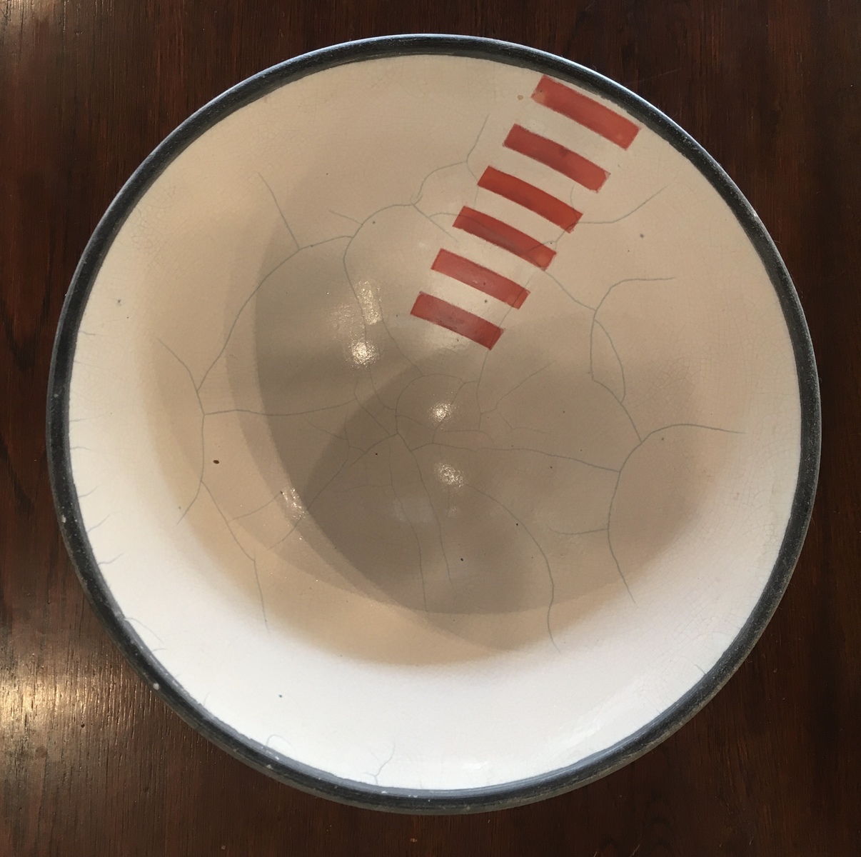 White bowl with red