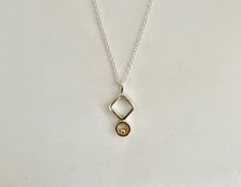 Stg. Silver and 22ct. gold pendant
